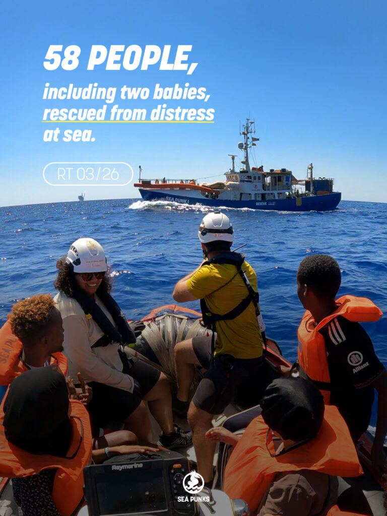 Rescue boat with crew and rescued people in life jackets, Sea Punk I behind