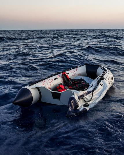 empty rubber boat in distress at sea