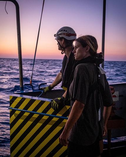 Crew members of Sea Punk I at embarkation gate, safety zone