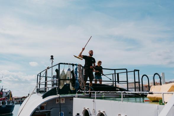 crew cleaning deck on Sea Punk I