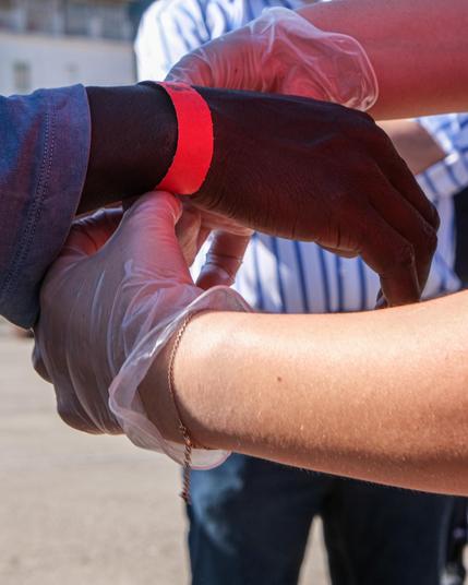 Red wrist band put on a survivors wrist after disembarking Sea Punk I